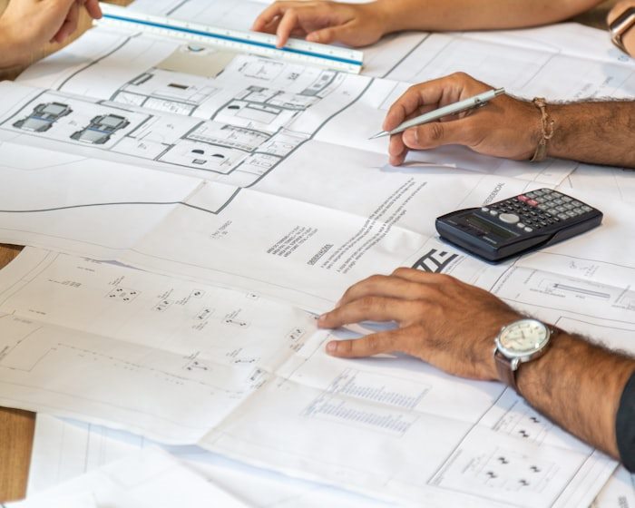 Engineers reviewing construction plans